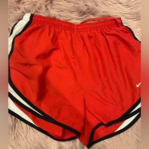 Red Nike athletic shorts